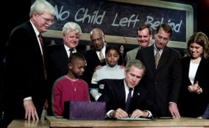 Visiting Hamilton High School in Hamilton, Ohio, Jan. 8, 2002, President George W. Bush signs into law the No Child Left Behind Act. Photographer: White House photographer Paul Morse